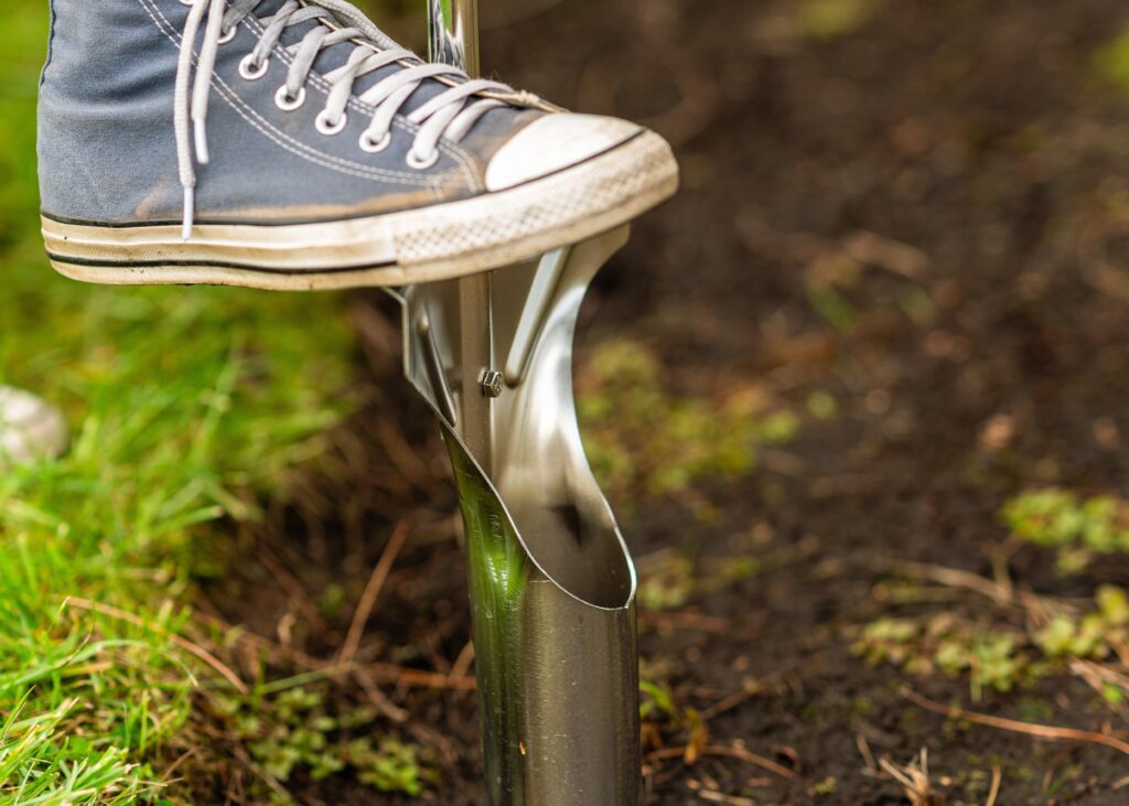 foot on bulb planter in new england