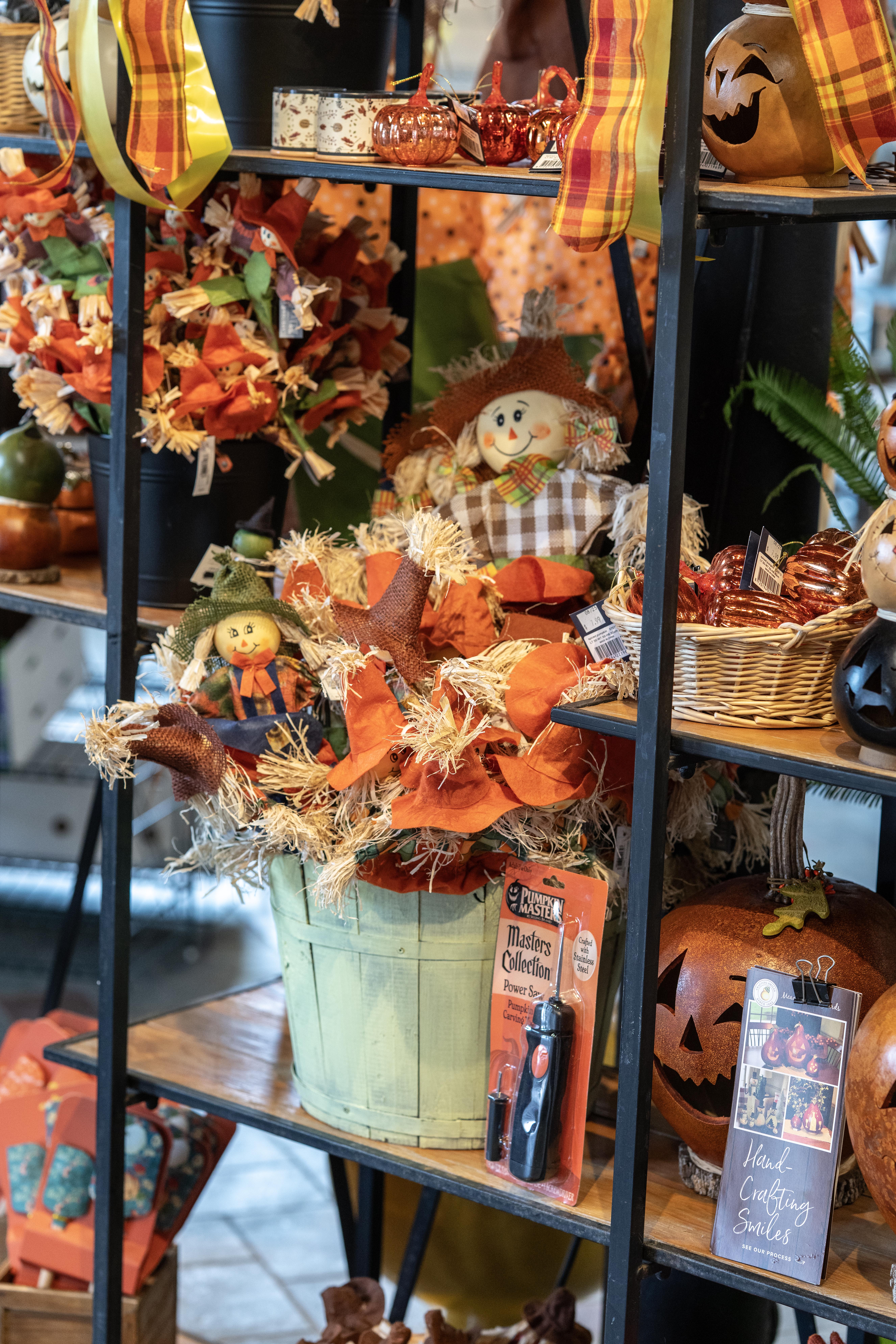 Shelves of decorative scarecrows, jack-o-lanterns and other fall and Halloween decor at Mahoney's Garden Center
